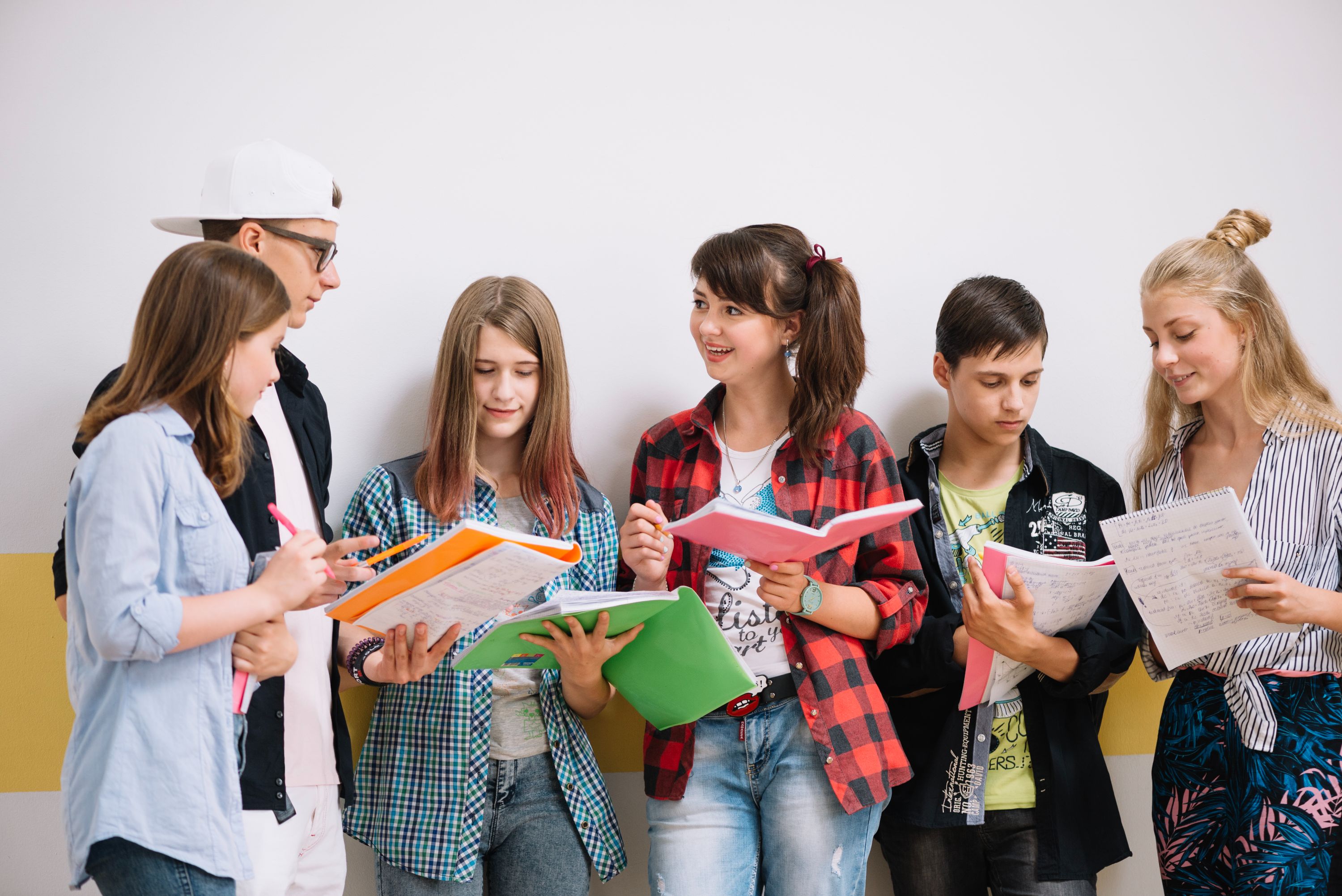classmates-standing-with-textbooks